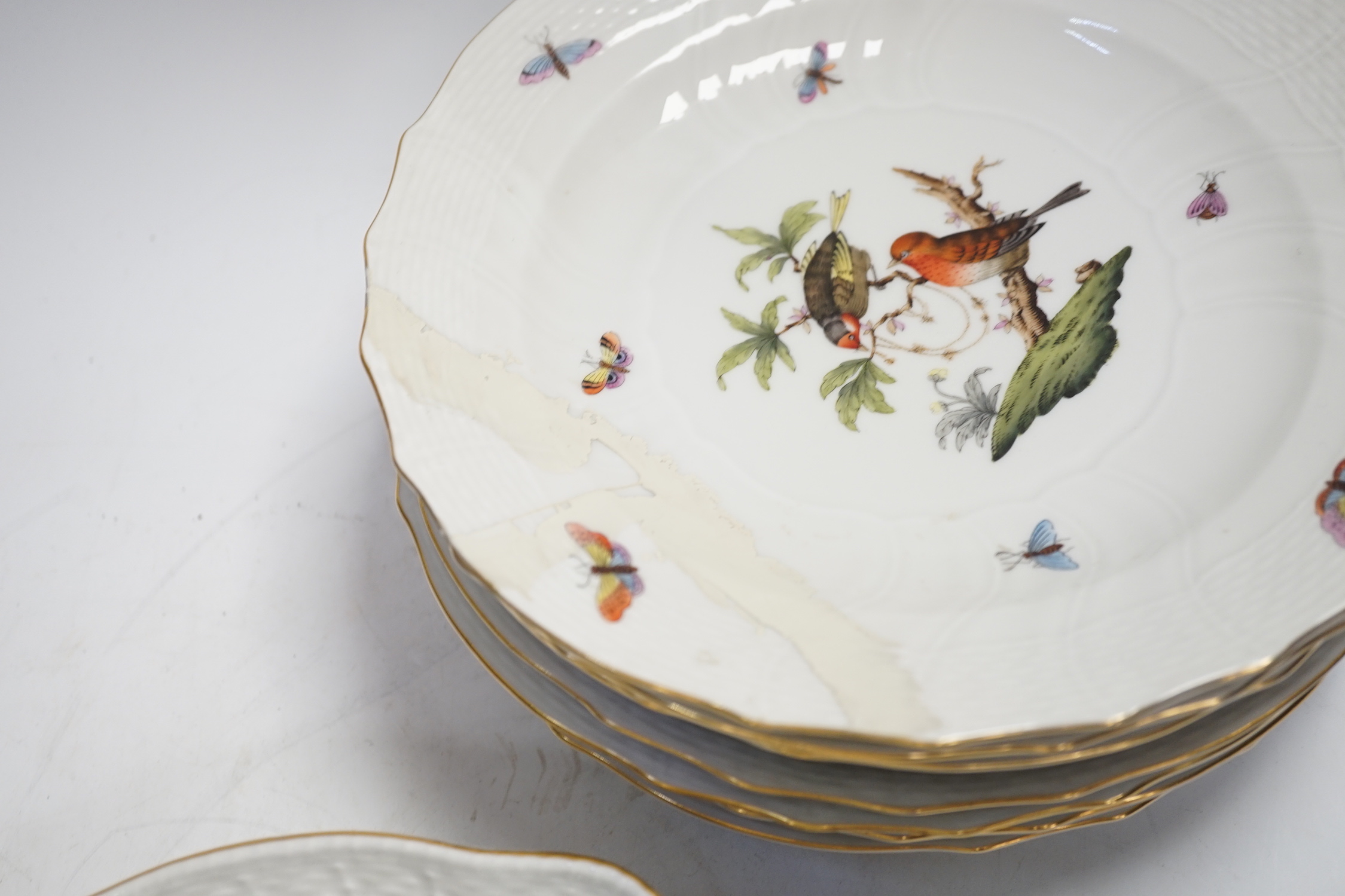 A Herend part dessert service comprising nine plates and two oval dishes together with two bowls, largest 26cm wide